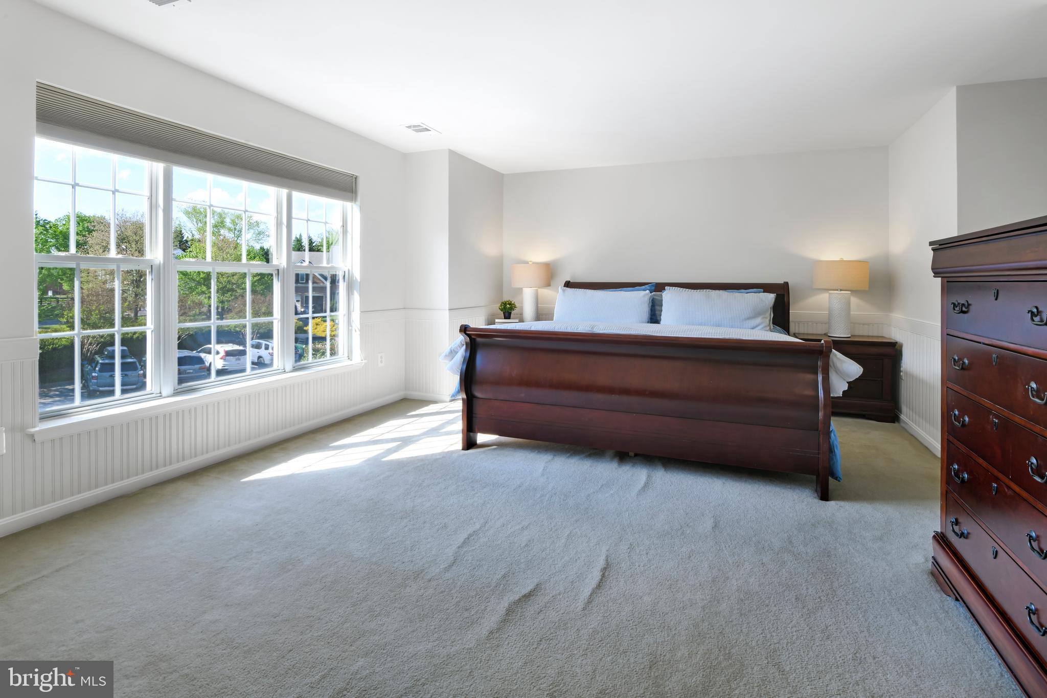 9105 Hendry Terrace Frederick, MD 21704 - Photo 18 of 51 a spacious bedroom with a bed and a large window