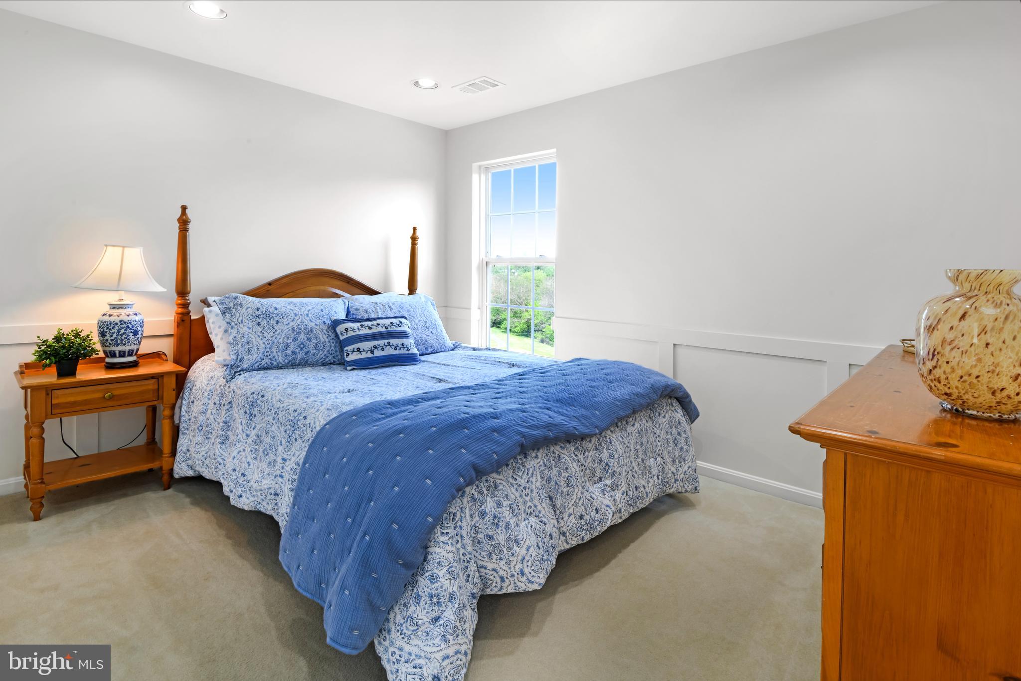 9105 Hendry Terrace Frederick, MD 21704 - Photo 24 of 51 a bedroom with a bed and a lamp on dresser