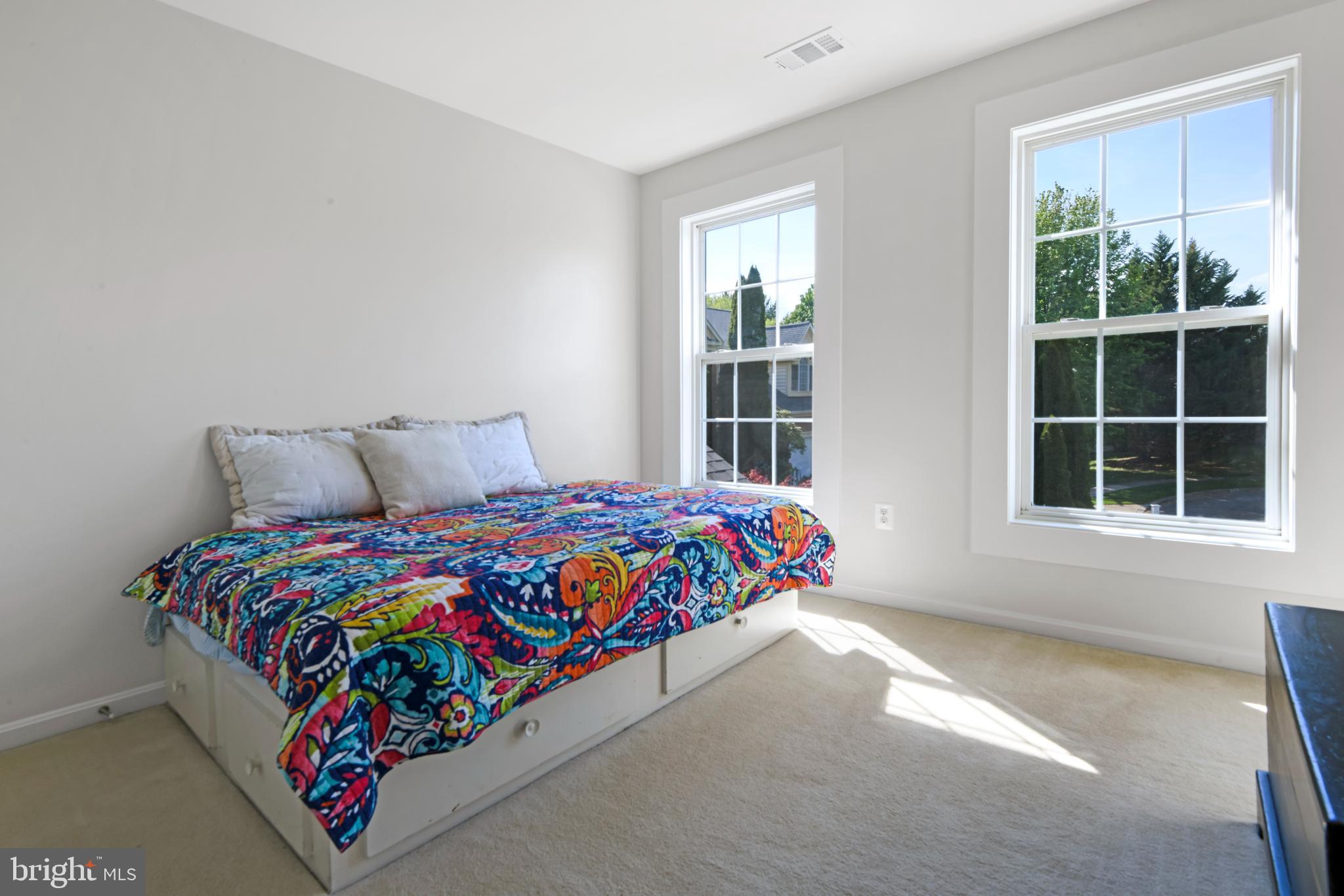 9105 Hendry Terrace Frederick, MD 21704 - Photo 25 of 51 a bed sitting in a bedroom next to a window