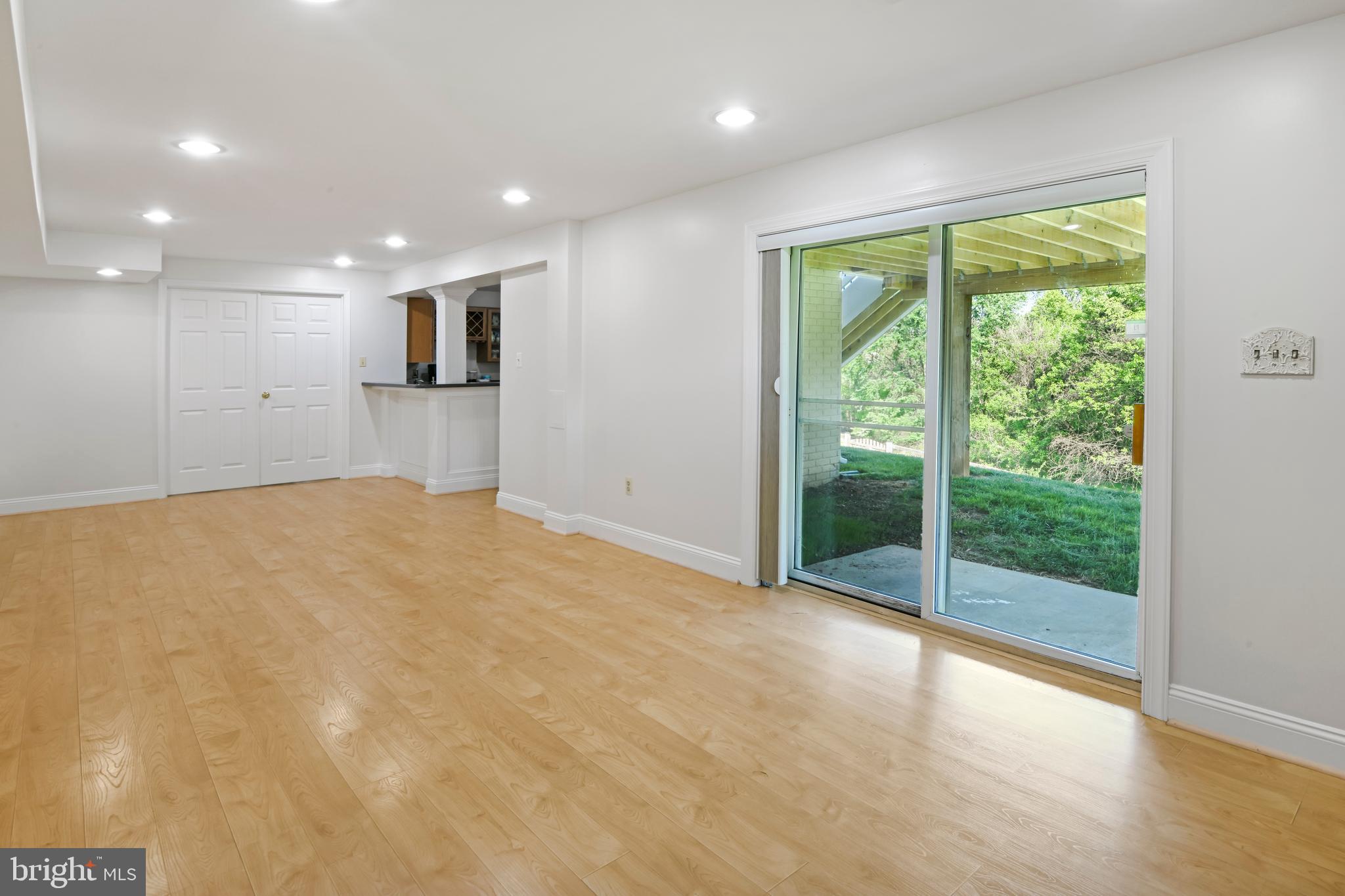 9105 Hendry Terrace Frederick, MD 21704 - Photo 27 of 51 a view of an empty room with wooden floor and a window