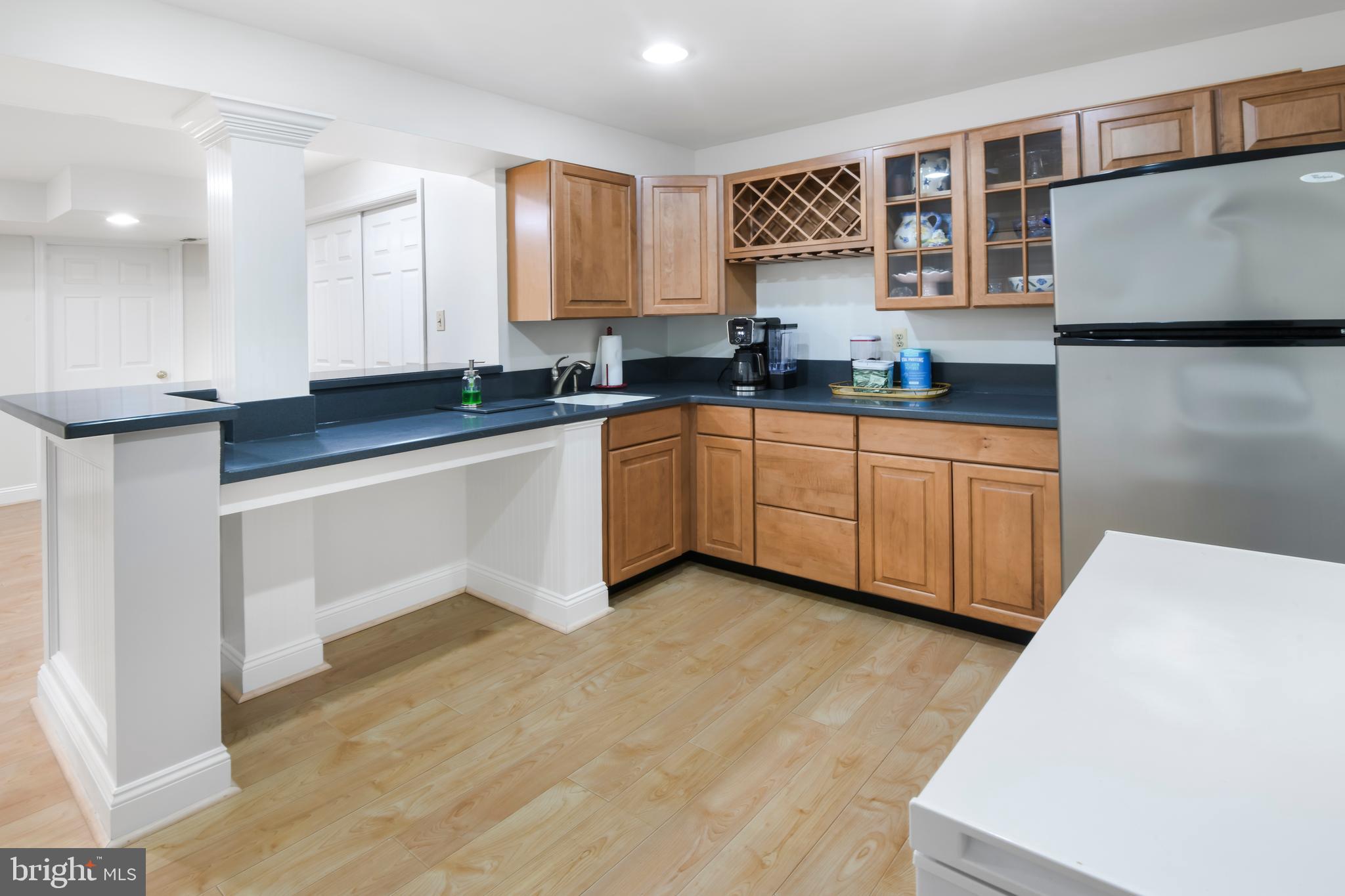 9105 Hendry Terrace Frederick, MD 21704 - Photo 31 of 51 a kitchen with stainless steel appliances granite countertop a sink and a stove top oven