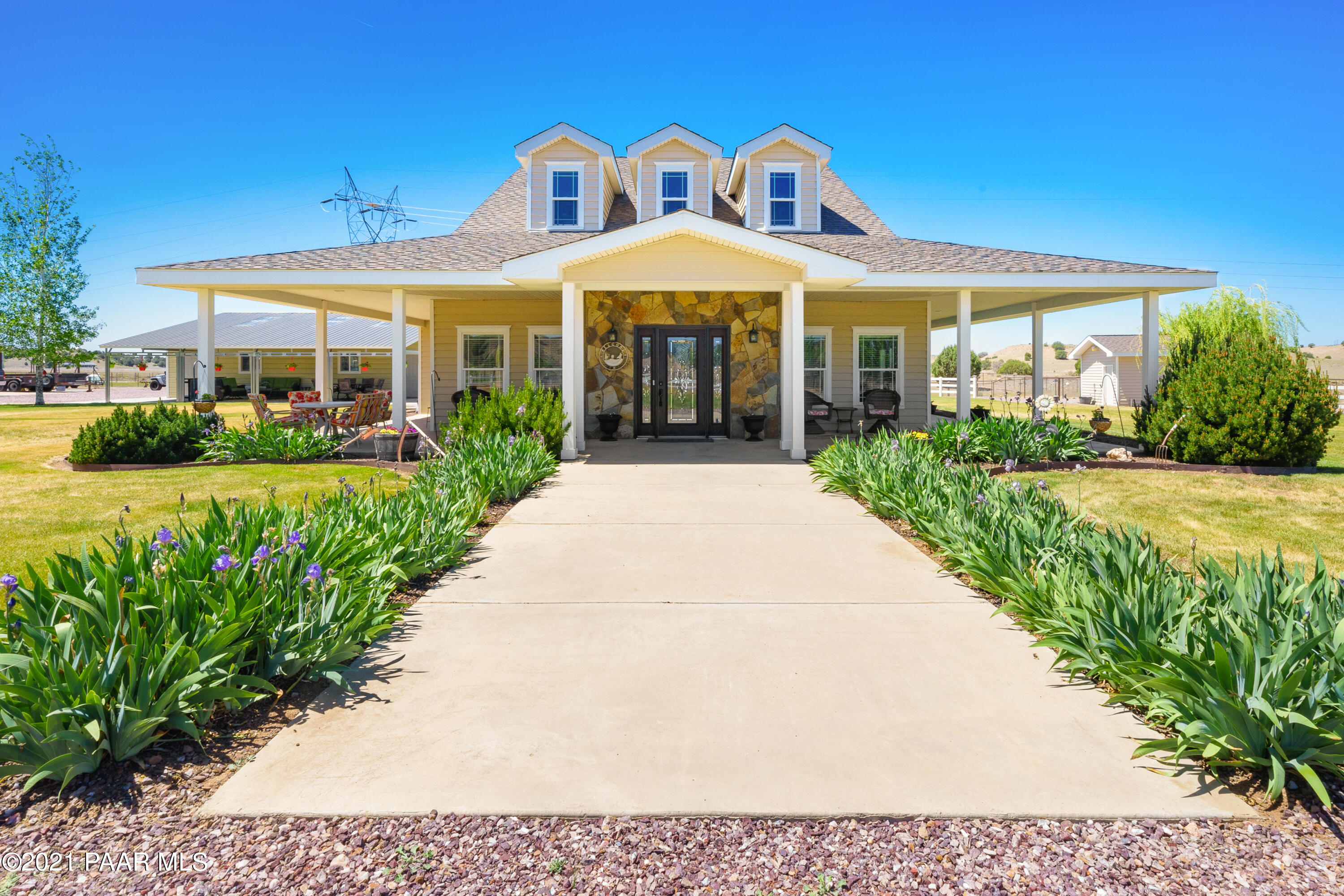 a front view of a house with garden