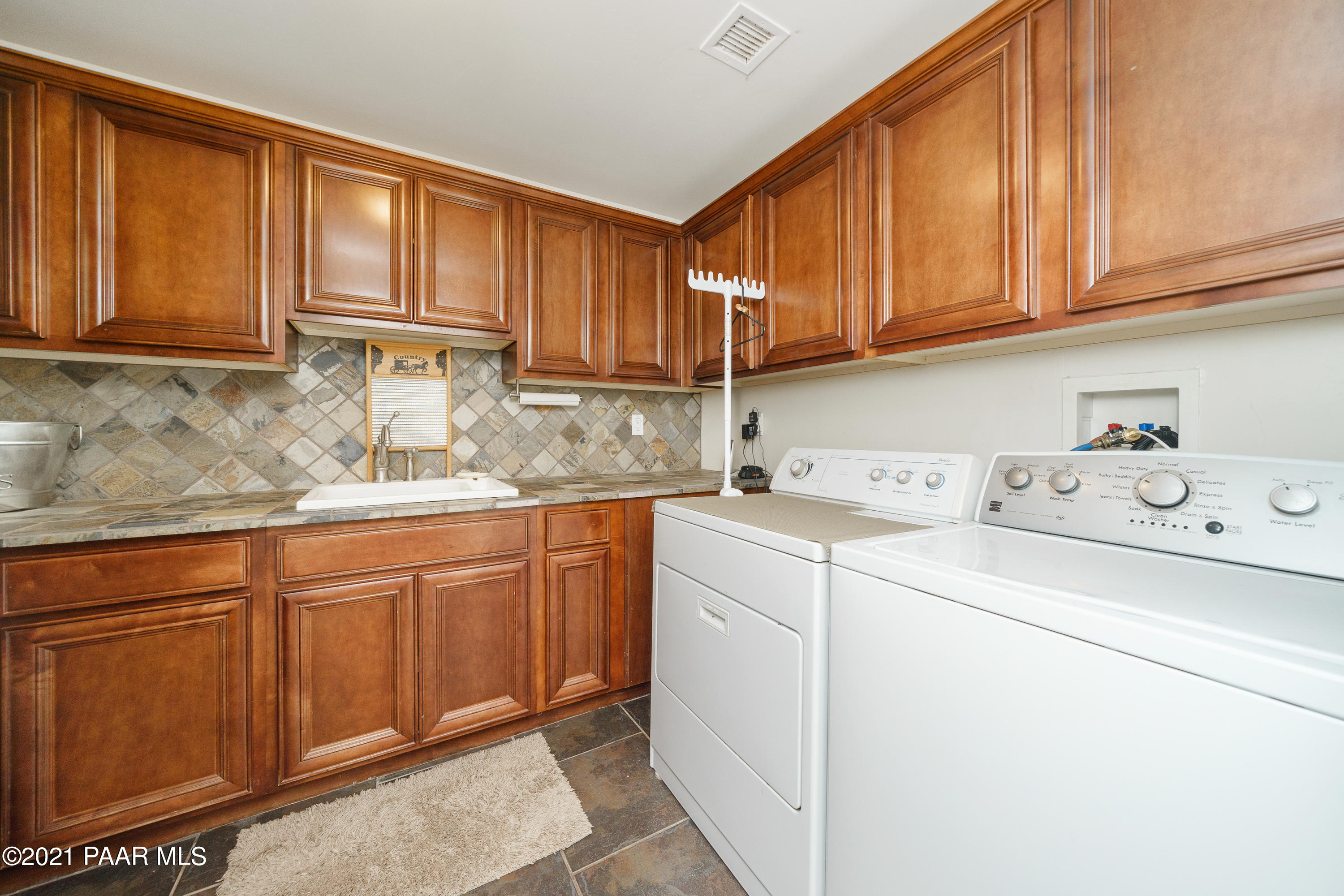 18000 North Lower Territory Road Prescott, AZ 86305 - Photo 17 of 42 a kitchen with stainless steel appliances granite countertop a sink stove and cabinets