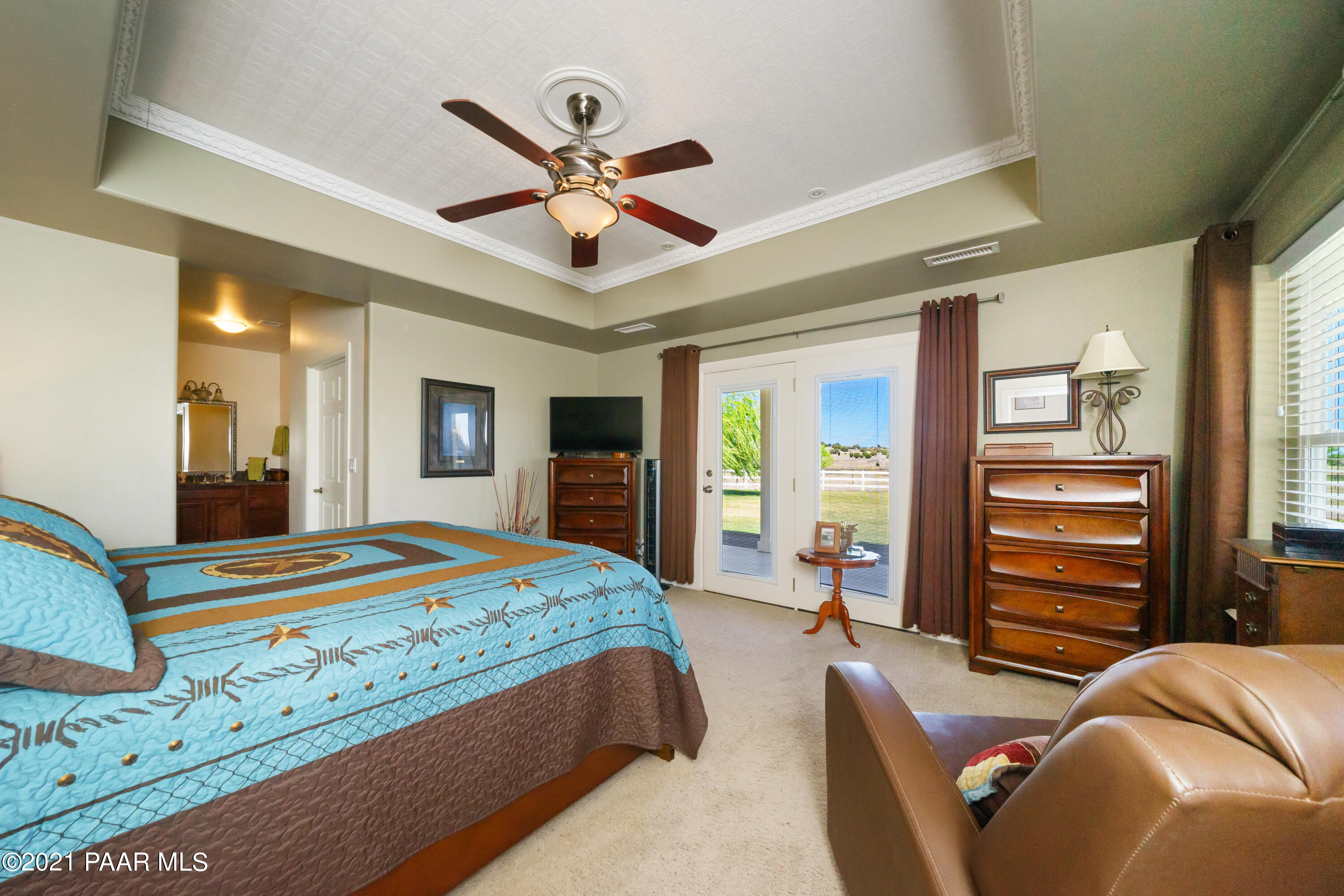 18000 North Lower Territory Road Prescott, AZ 86305 - Photo 18 of 42 a bedroom with a bed and ceiling fan