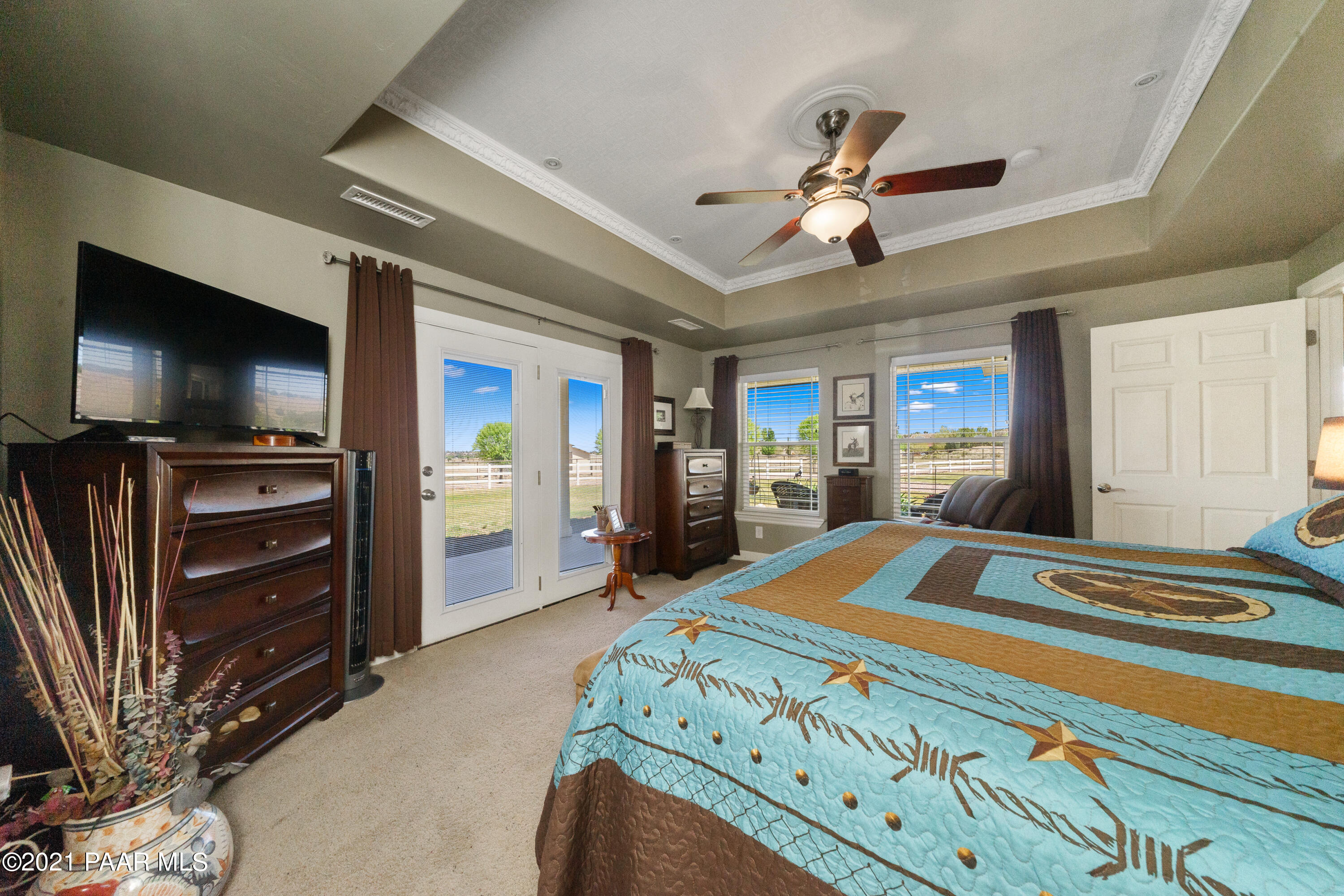 18000 North Lower Territory Road Prescott, AZ 86305 - Photo 20 of 42 a bedroom with a bed and a flat screen tv