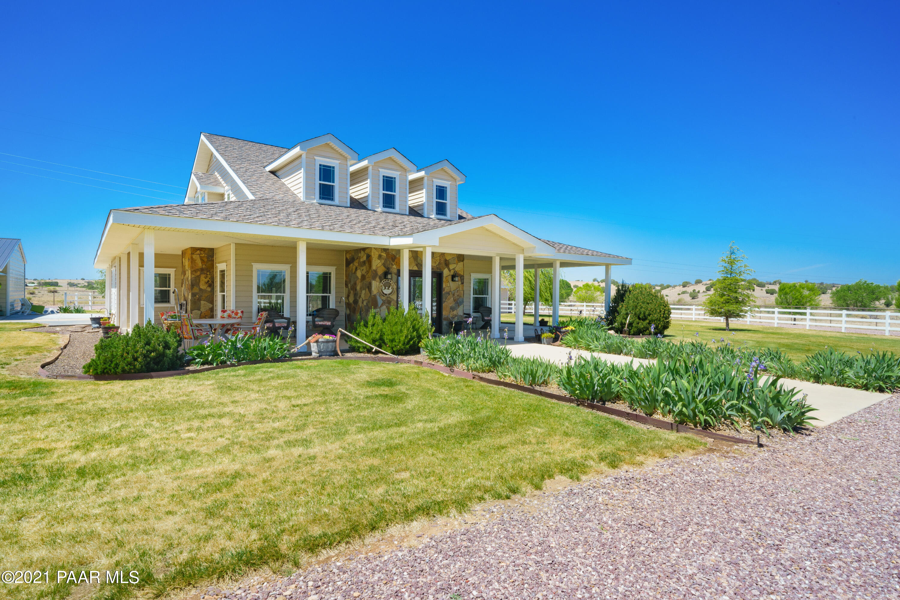 18000 North Lower Territory Road Prescott, AZ 86305 - Photo 2 of 42 a front view of a house with a yard