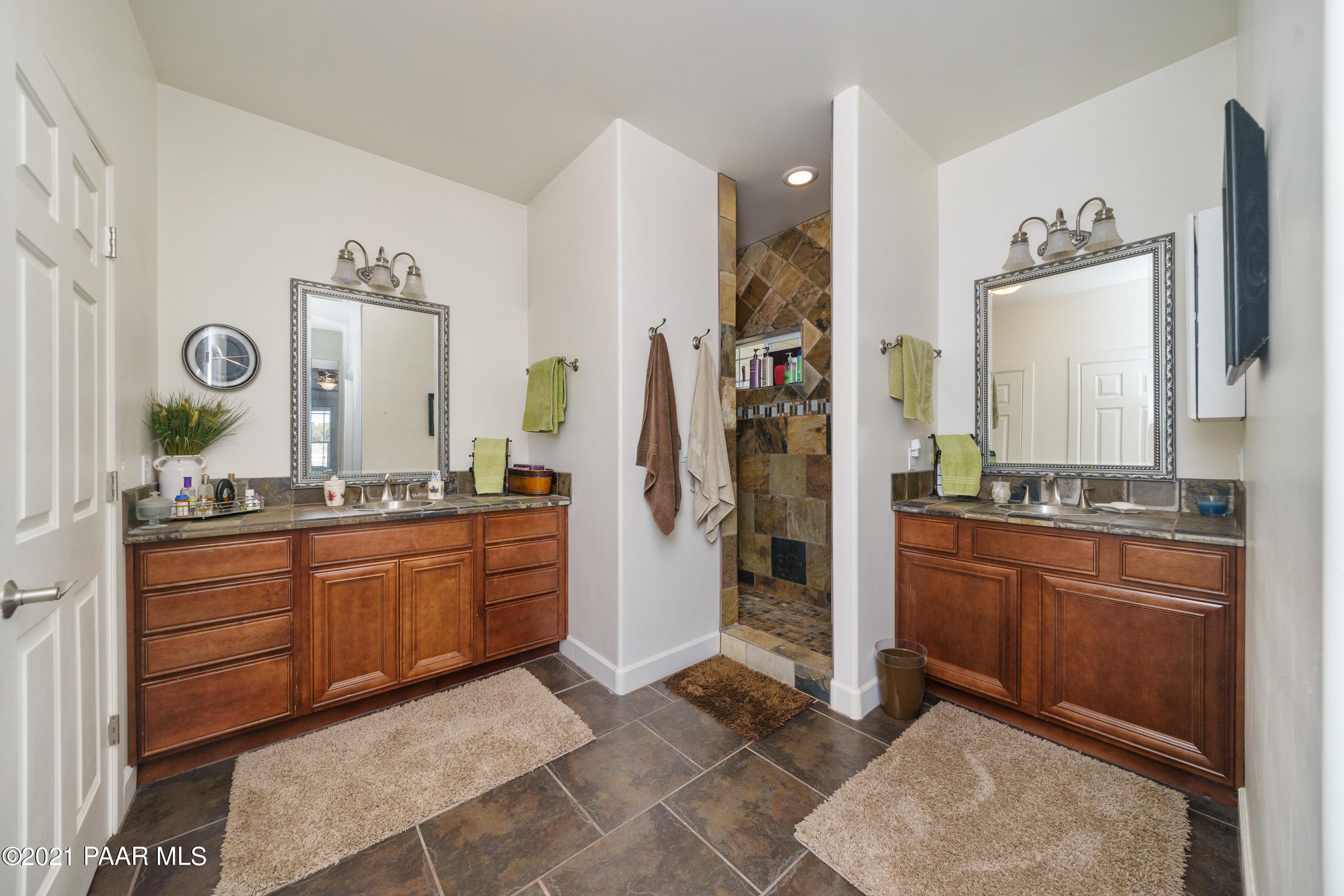 18000 North Lower Territory Road Prescott, AZ 86305 - Photo 21 of 42 a large bathroom with a granite countertop sink and a mirror