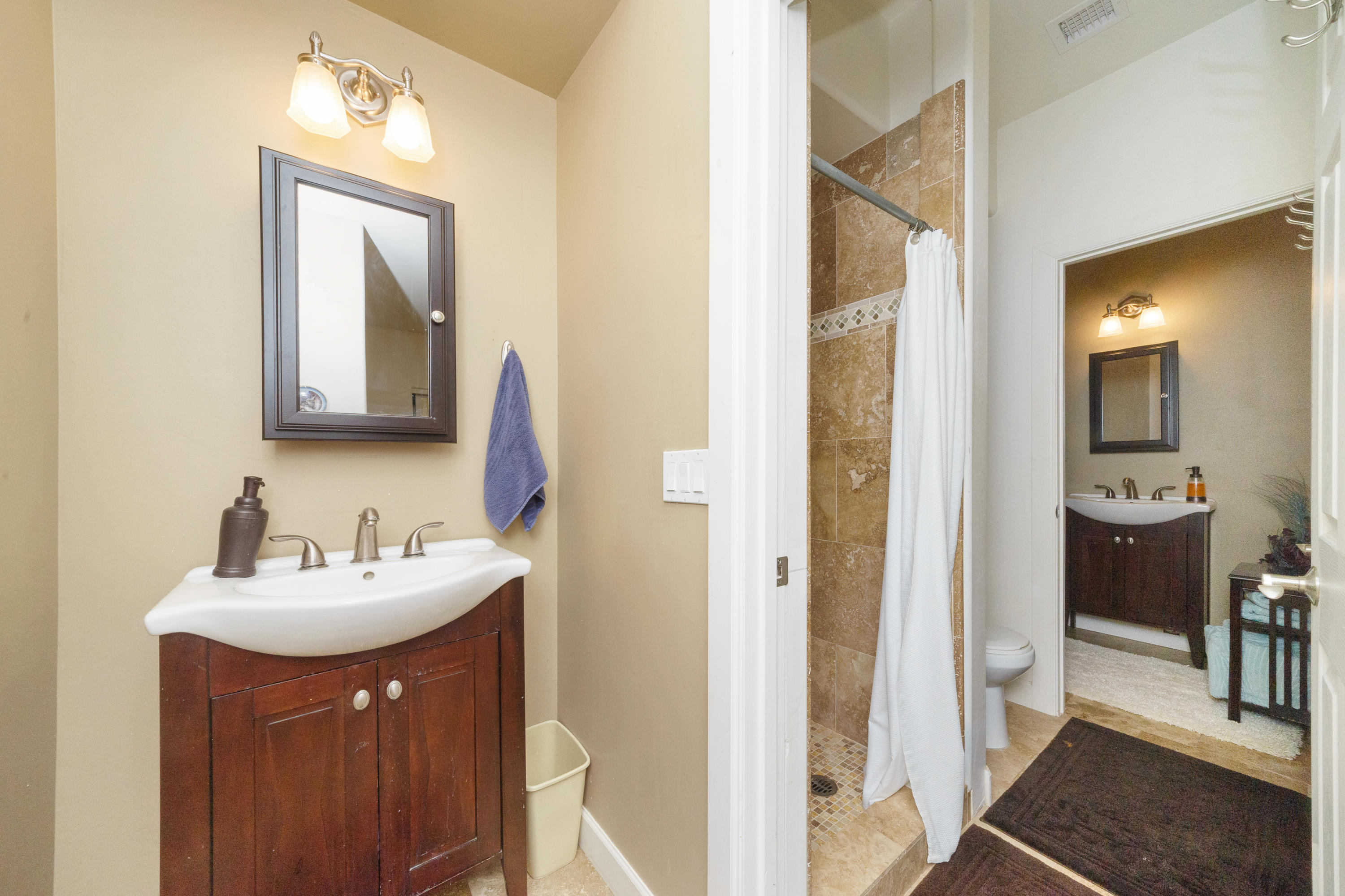 18000 North Lower Territory Road Prescott, AZ 86305 - Photo 25 of 42 a bathroom with a sink a mirror and a shower