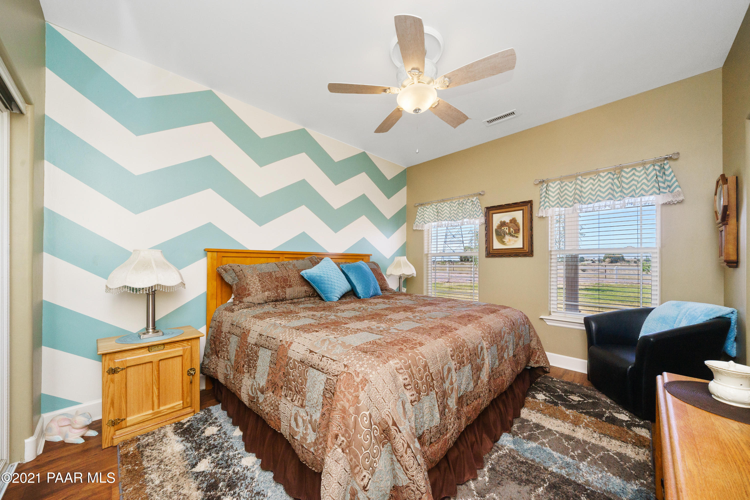 18000 North Lower Territory Road Prescott, AZ 86305 - Photo 27 of 42 a bedroom with a bed a couch and dresser