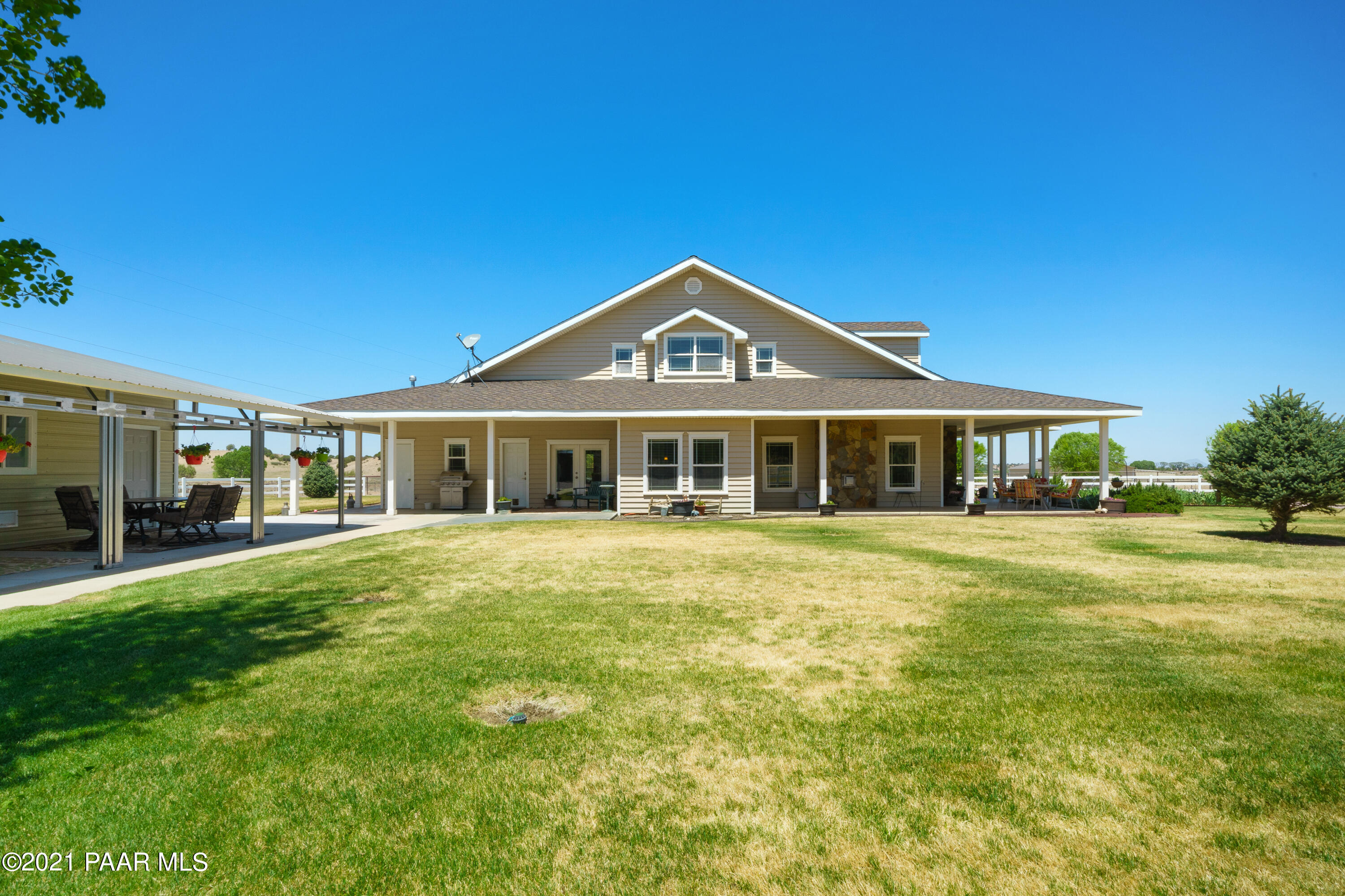18000 North Lower Territory Road Prescott, AZ 86305 - Photo 35 of 42 a front view of a house with a garden