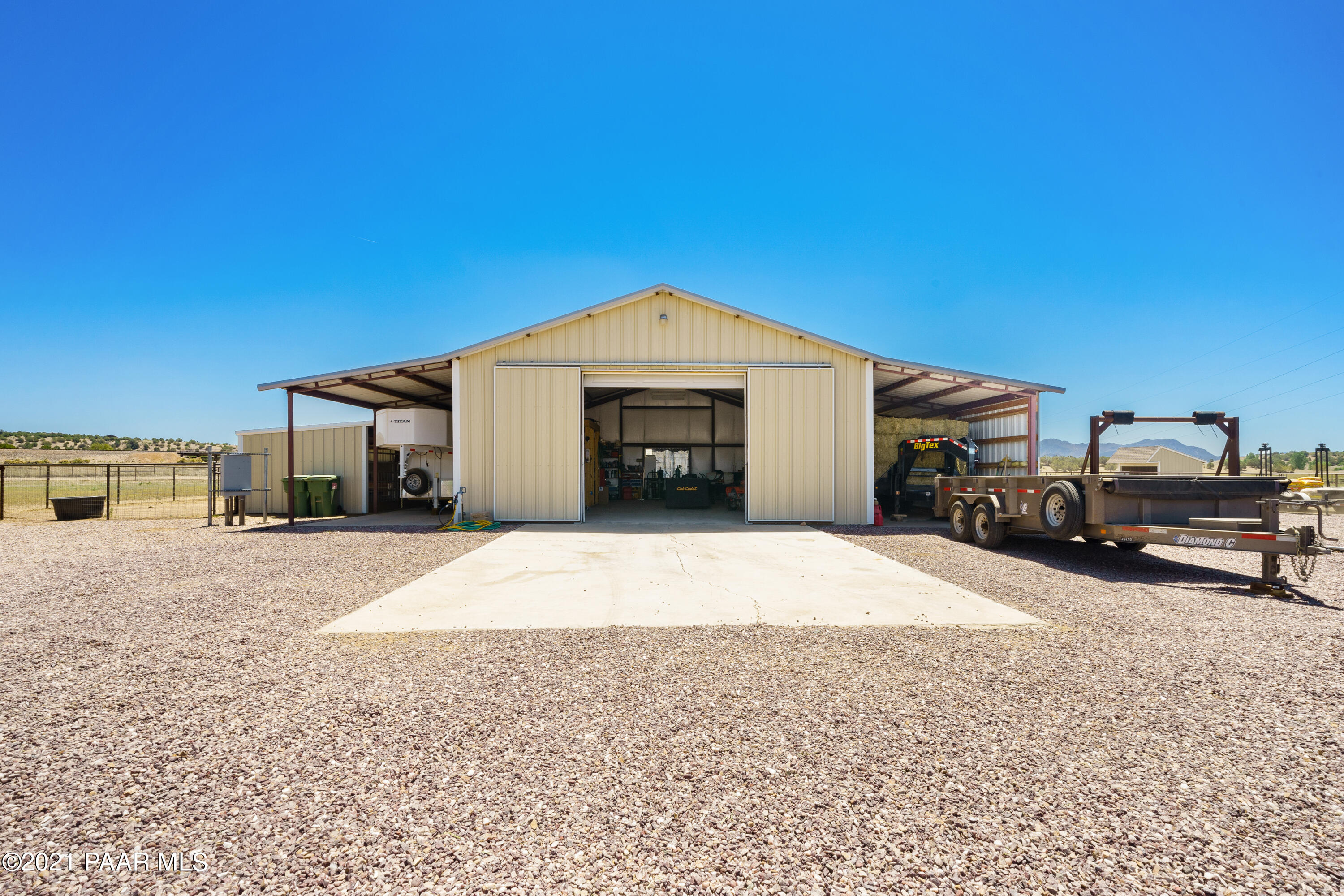 18000 North Lower Territory Road Prescott, AZ 86305 - Photo 39 of 42 a front view of a house with a parking space and a car parked in it