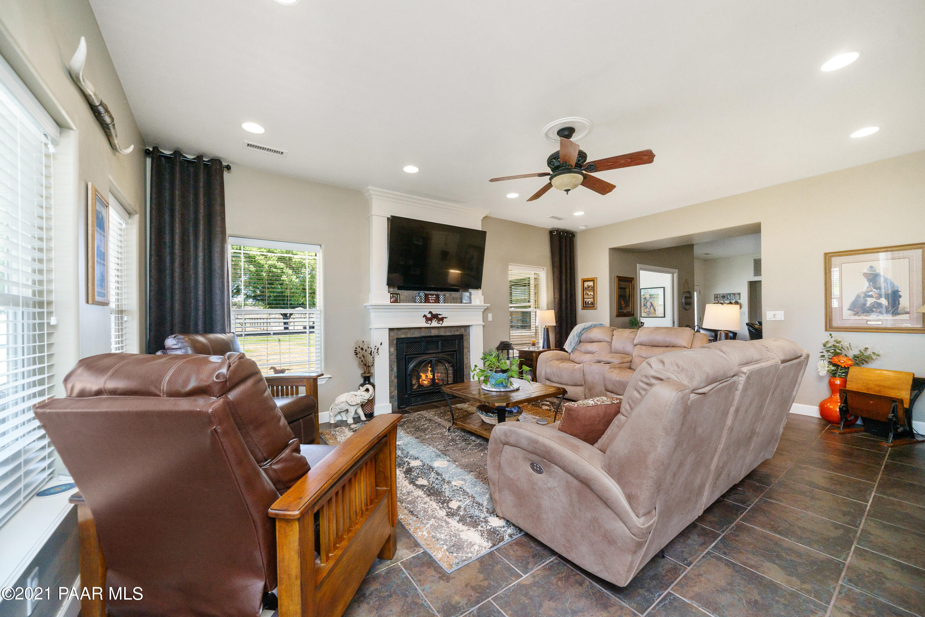 18000 North Lower Territory Road Prescott, AZ 86305 - Photo 7 of 42 a living room with furniture a fireplace and a flat screen tv