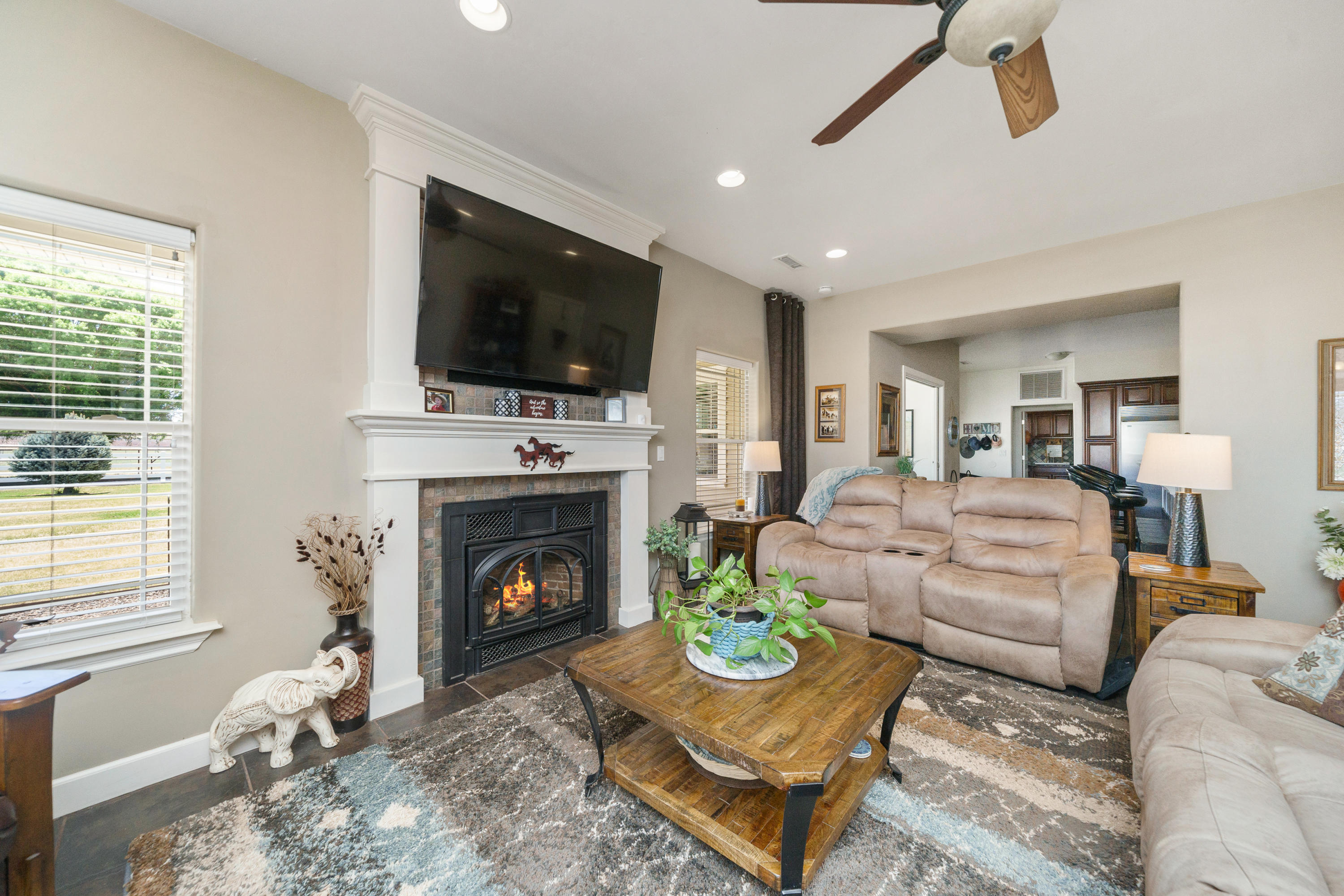 18000 North Lower Territory Road Prescott, AZ 86305 - Photo 8 of 42 a living room with furniture a flat screen tv and a fireplace