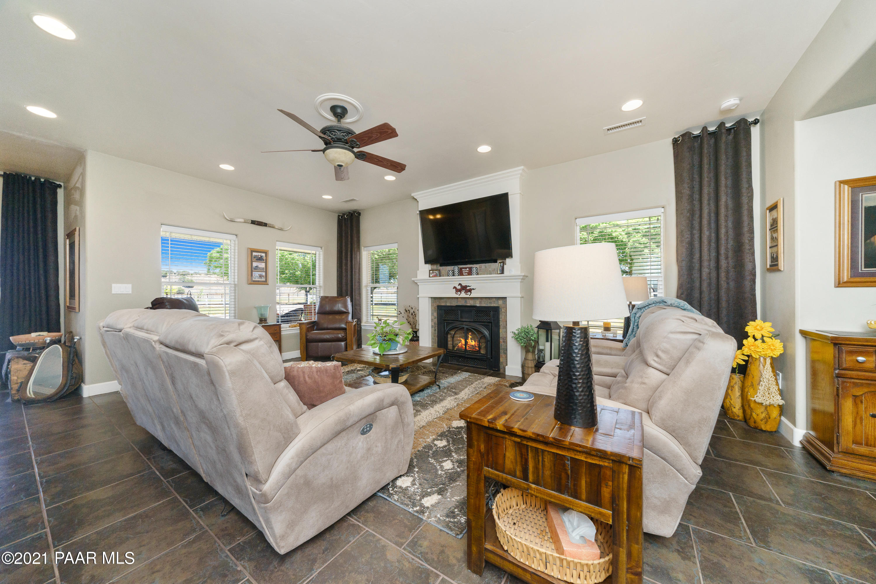 18000 North Lower Territory Road Prescott, AZ 86305 - Photo 10 of 42 a living room with furniture a fireplace and a flat screen tv