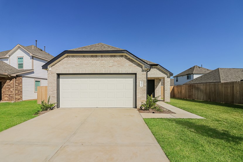 3075 Wild Indigo Trail Brookshire, TX 77423 - Photo 2 of 16 a front view of a house with a yard