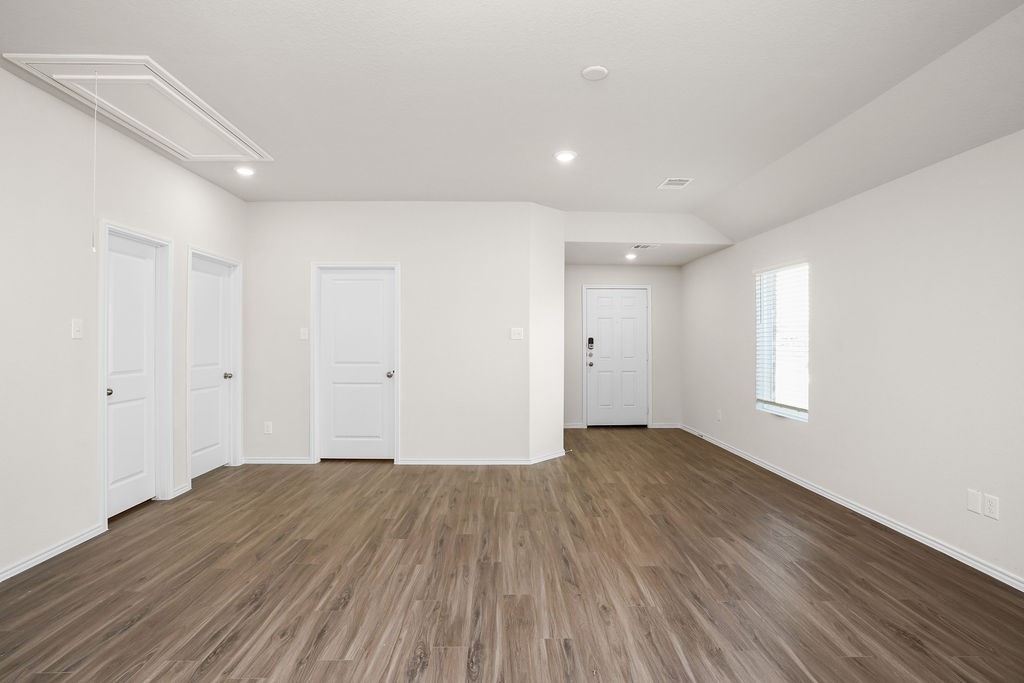 3075 Wild Indigo Trail Brookshire, TX 77423 - Photo 7 of 16 a view of an empty room with wooden floor and window