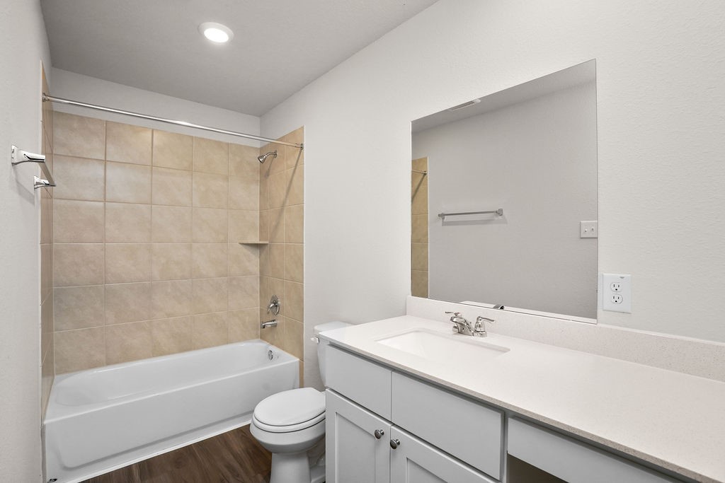 3075 Wild Indigo Trail Brookshire, TX 77423 - Photo 9 of 16 a bathroom with a sink a toilet and a bathtub