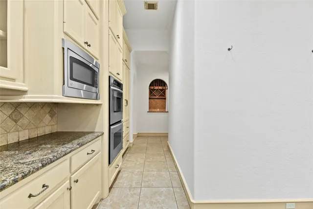 a view of a kitchen with granite countertop cabinets and a granite counter tops