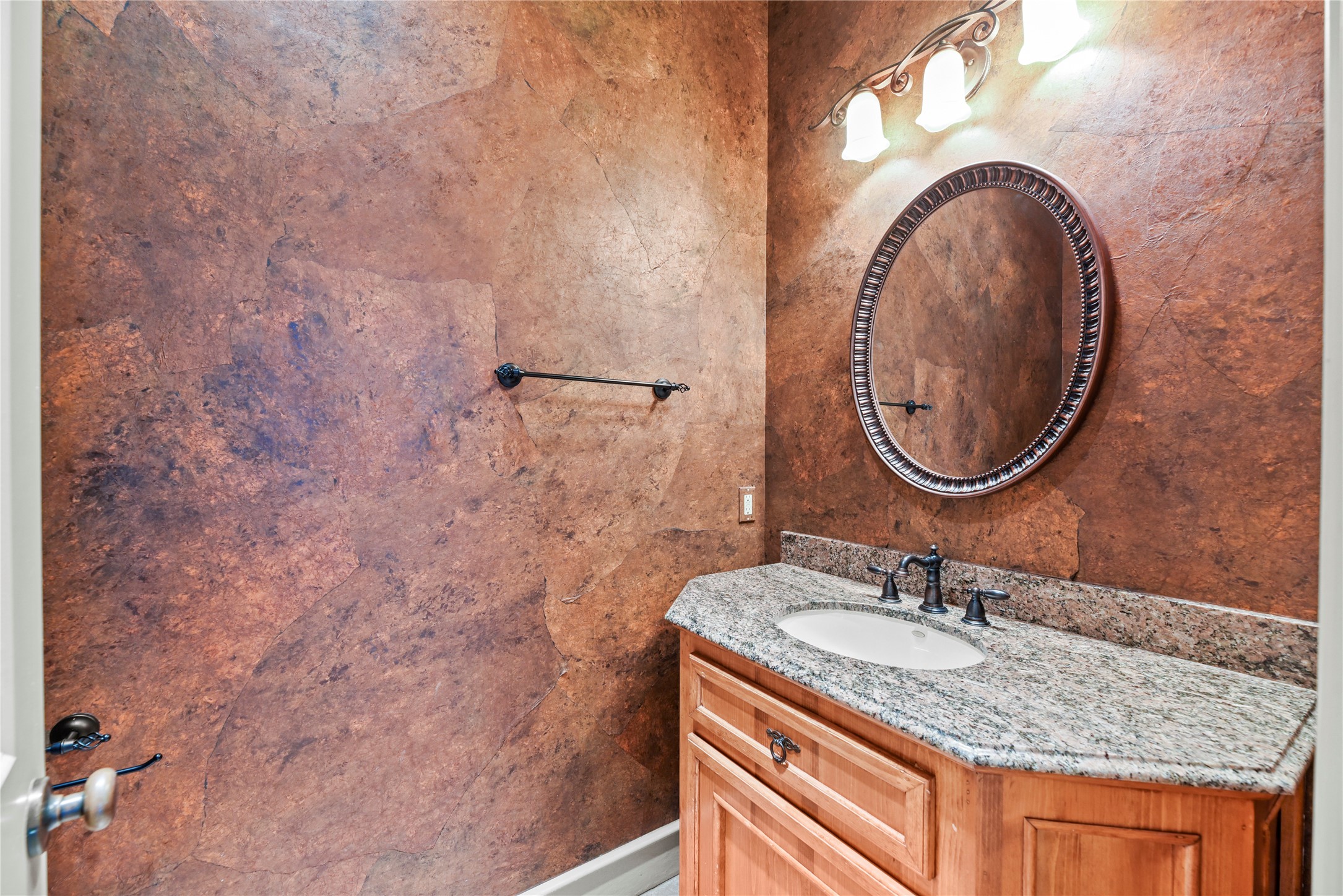 16610 Champagne Falls Court Spring, TX 77379 - Photo 25 of 45 a bathroom with a granite countertop sink and a mirror