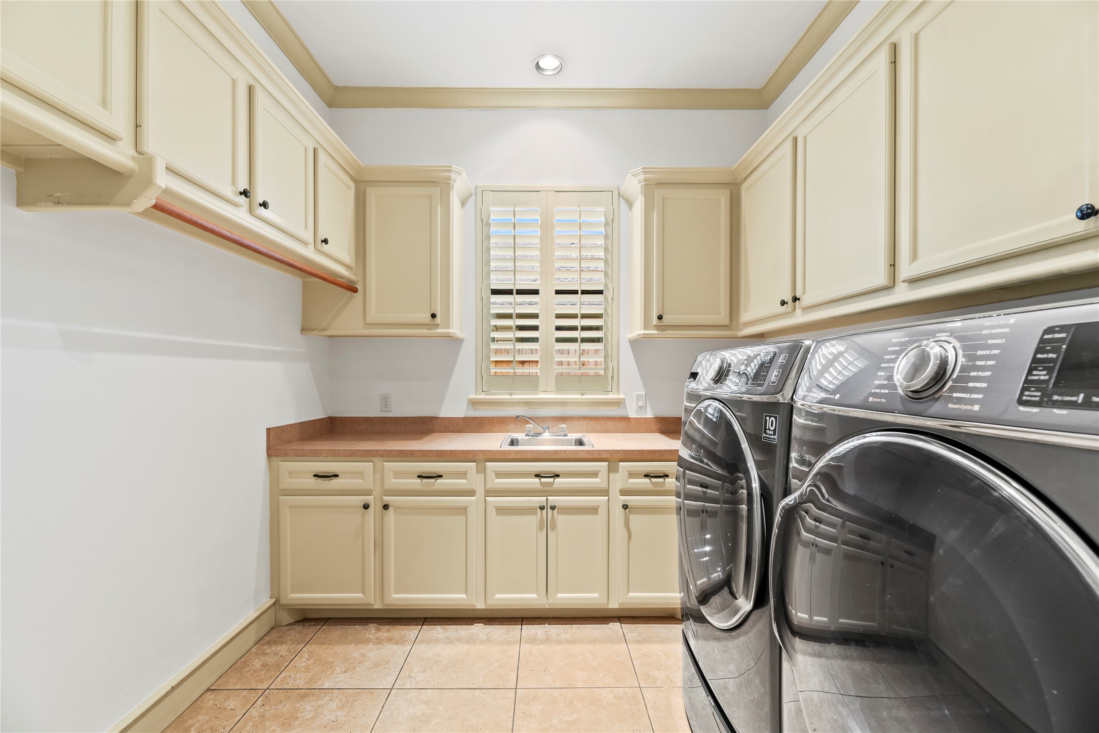 16610 Champagne Falls Court Spring, TX 77379 - Photo 27 of 45 a utility room with sink dryer and washer