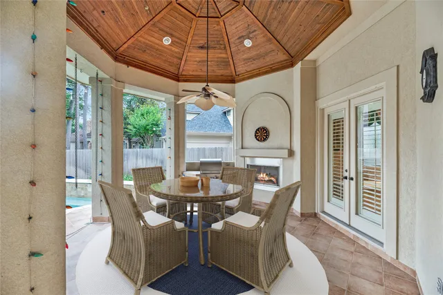 a dining room with furniture and chandelier