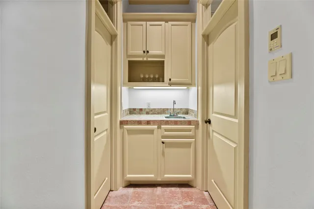 a bathroom with a sink vanity and mirror