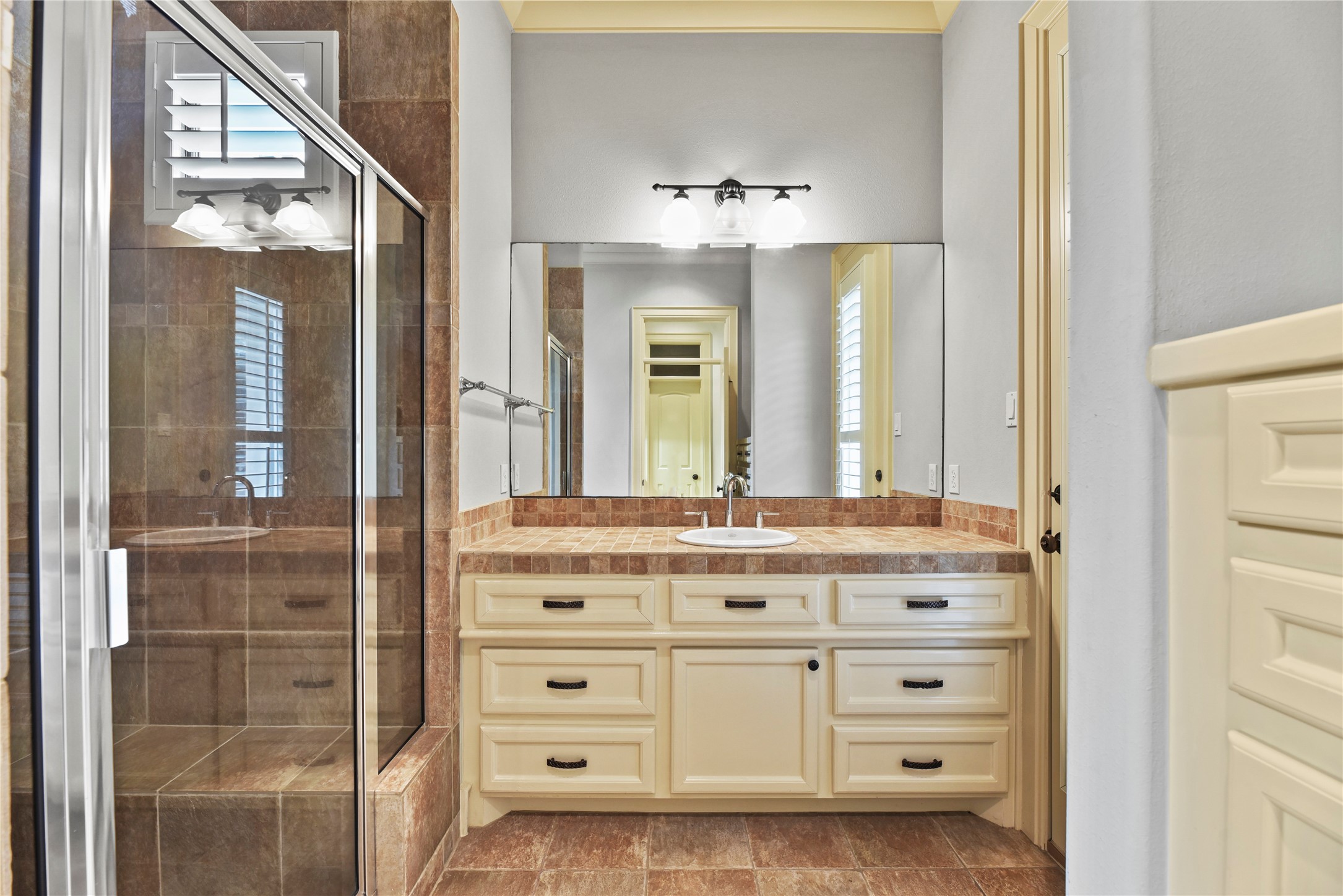 16610 Champagne Falls Court Spring, TX 77379 - Photo 38 of 45 a bathroom with a sink vanity and mirror