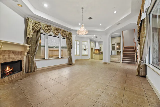a view of an empty room with a fireplace