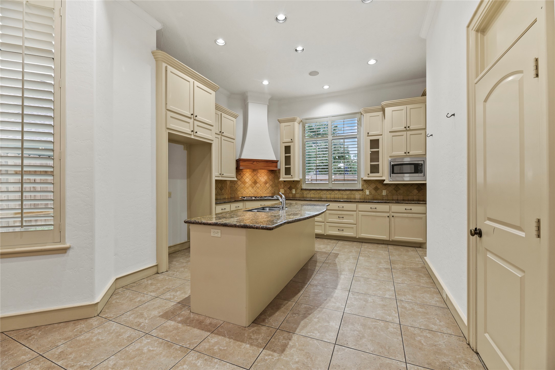 16610 Champagne Falls Court Spring, TX 77379 - Photo 9 of 45 a kitchen with stainless steel appliances granite countertop a refrigerator and a sink