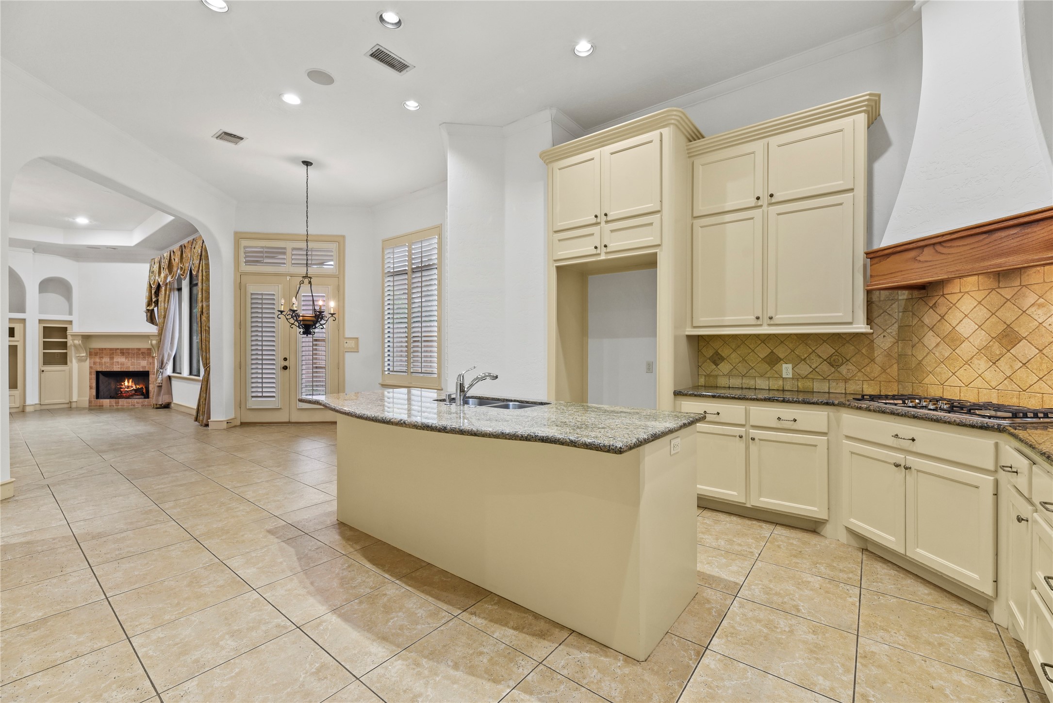 16610 Champagne Falls Court Spring, TX 77379 - Photo 10 of 45 a large kitchen with granite countertop a sink and cabinets