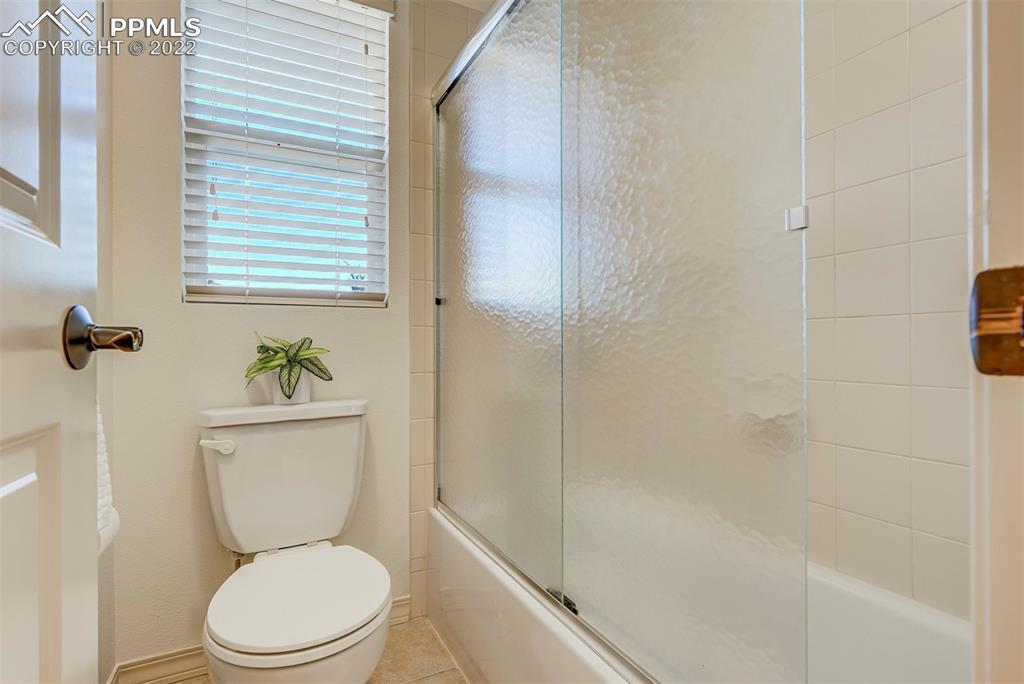 2323 Cinnabar Road Colorado Springs, CO 80921 - Photo 31 of 50 a white toilet sitting next to a bathroom sink