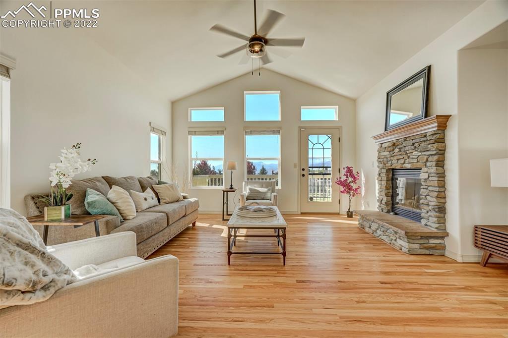 2323 Cinnabar Road Colorado Springs, CO 80921 - Photo 4 of 50 a living room with furniture large window and a fireplace