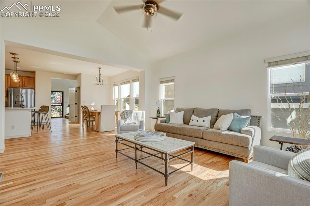 2323 Cinnabar Road Colorado Springs, CO 80921 - Photo 8 of 50 a living room with furniture and a wooden floor