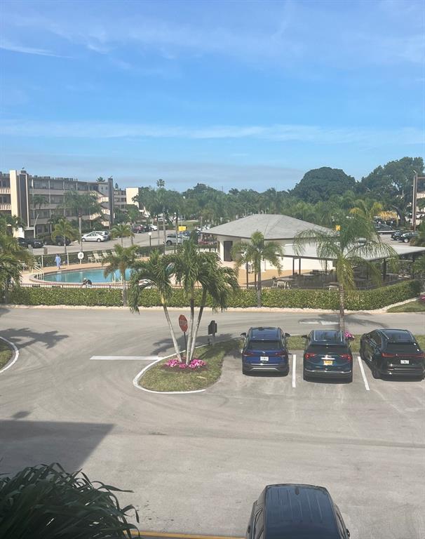 3050 Wolverton C, Unit 3050 Boca Raton, FL 33434 - Photo 5 of 19 a view of a lake with a city