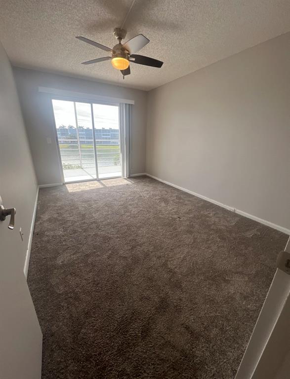 3050 Wolverton C, Unit 3050 Boca Raton, FL 33434 - Photo 8 of 19 an empty room with a window