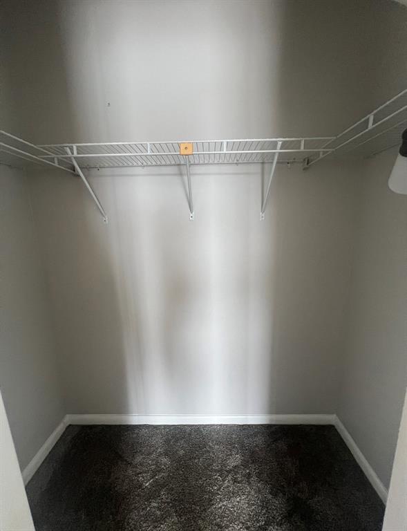 3050 Wolverton C, Unit 3050 Boca Raton, FL 33434 - Photo 9 of 19 a view of a room with racks on the wall