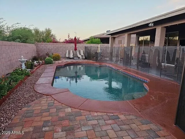 a view of swimming pool with a lounge chair