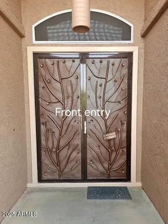 a view of a door and a window
