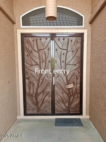 a view of a door and a window