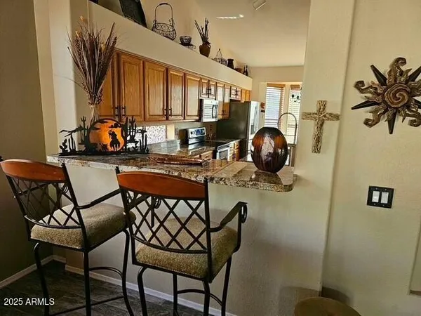 a dining room with furniture and window