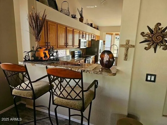 a dining room with furniture and window