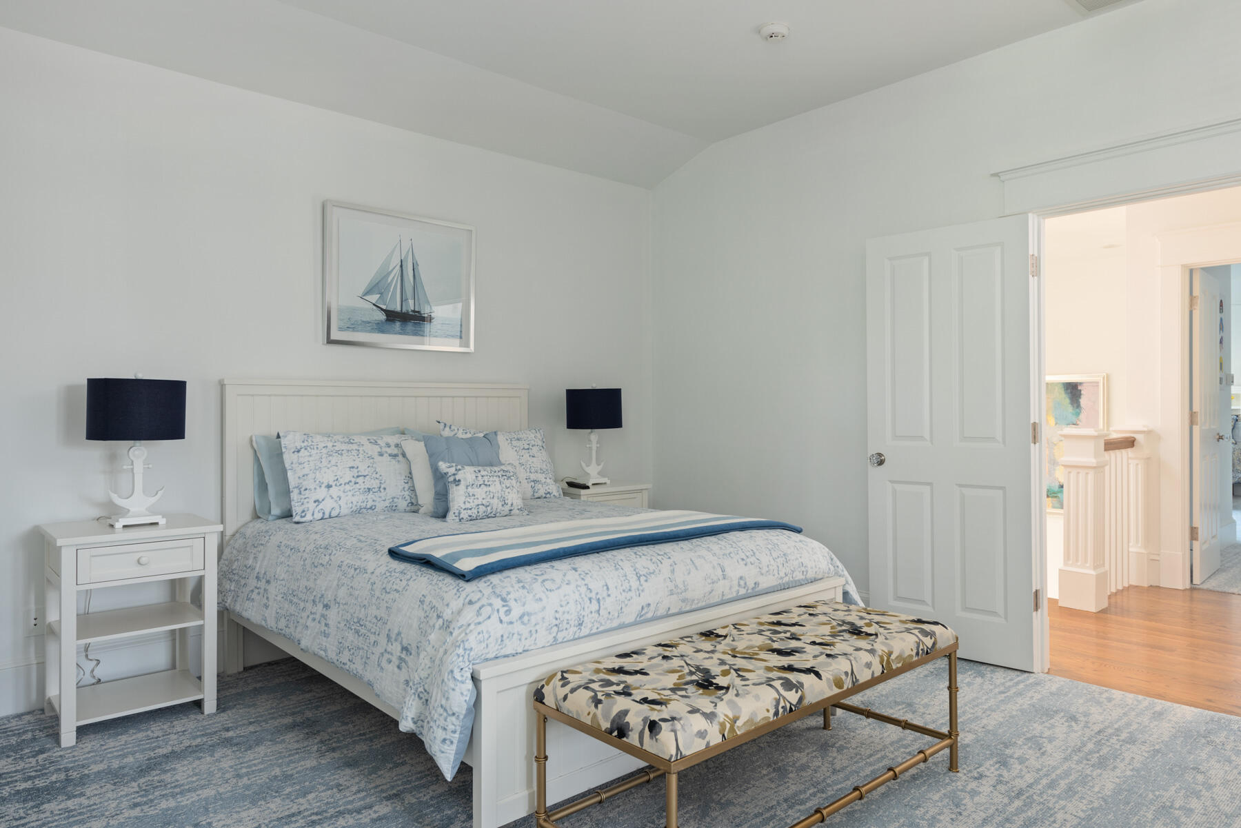 350 Windswept Way Osterville, MA 02655 - Photo 17 of 32 a bedroom with a bed and a lamp on dresser