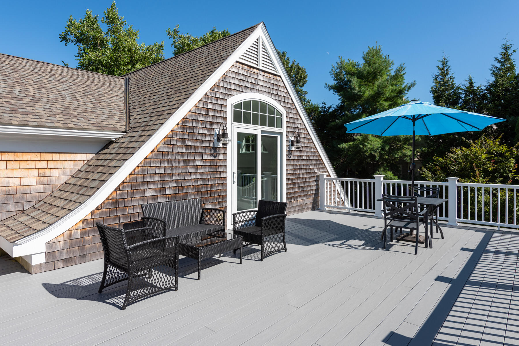 350 Windswept Way Osterville, MA 02655 - Photo 23 of 32 a view of a chair and table on the deck in the patio