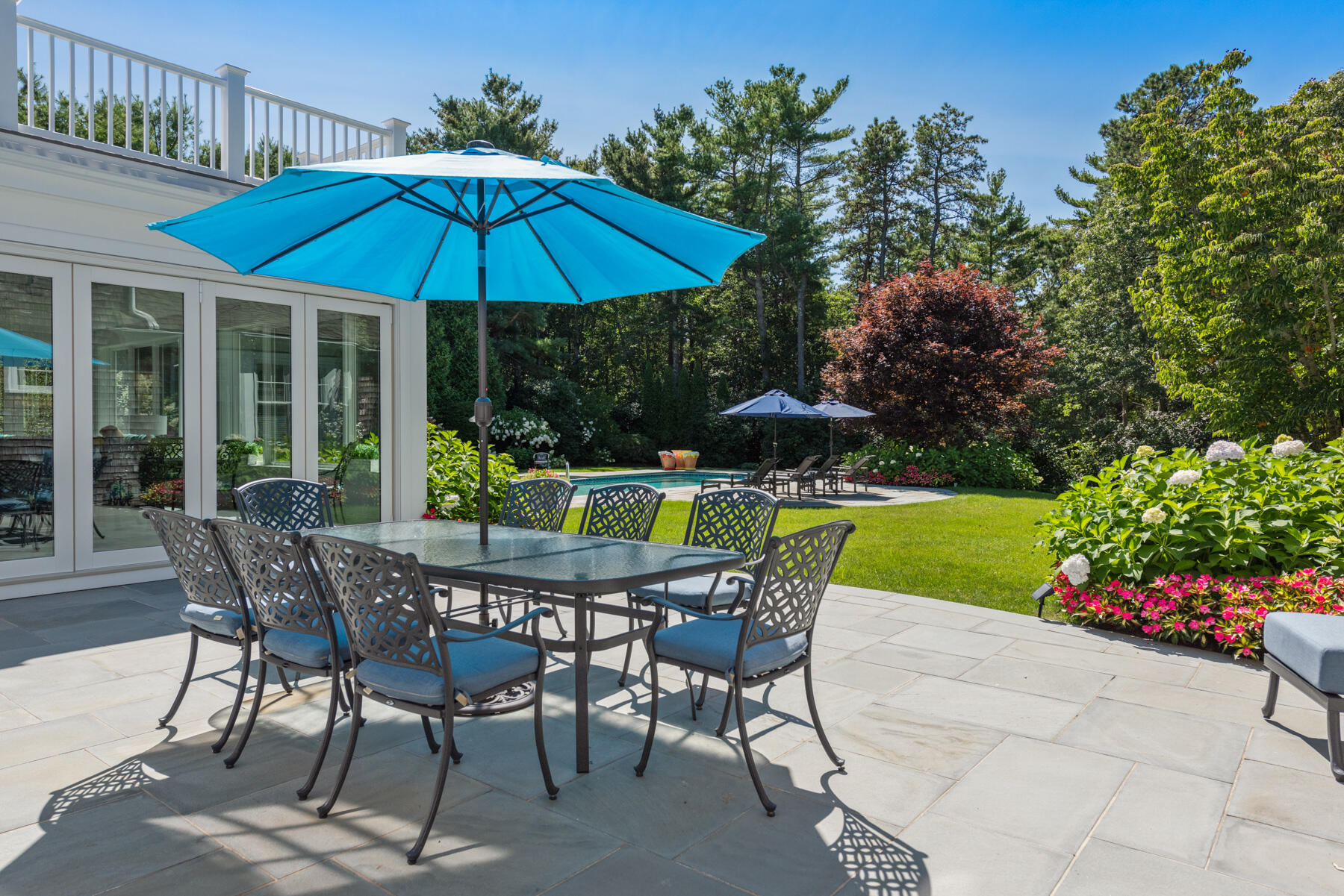 350 Windswept Way Osterville, MA 02655 - Photo 26 of 32 a patio with a patio table and chairs