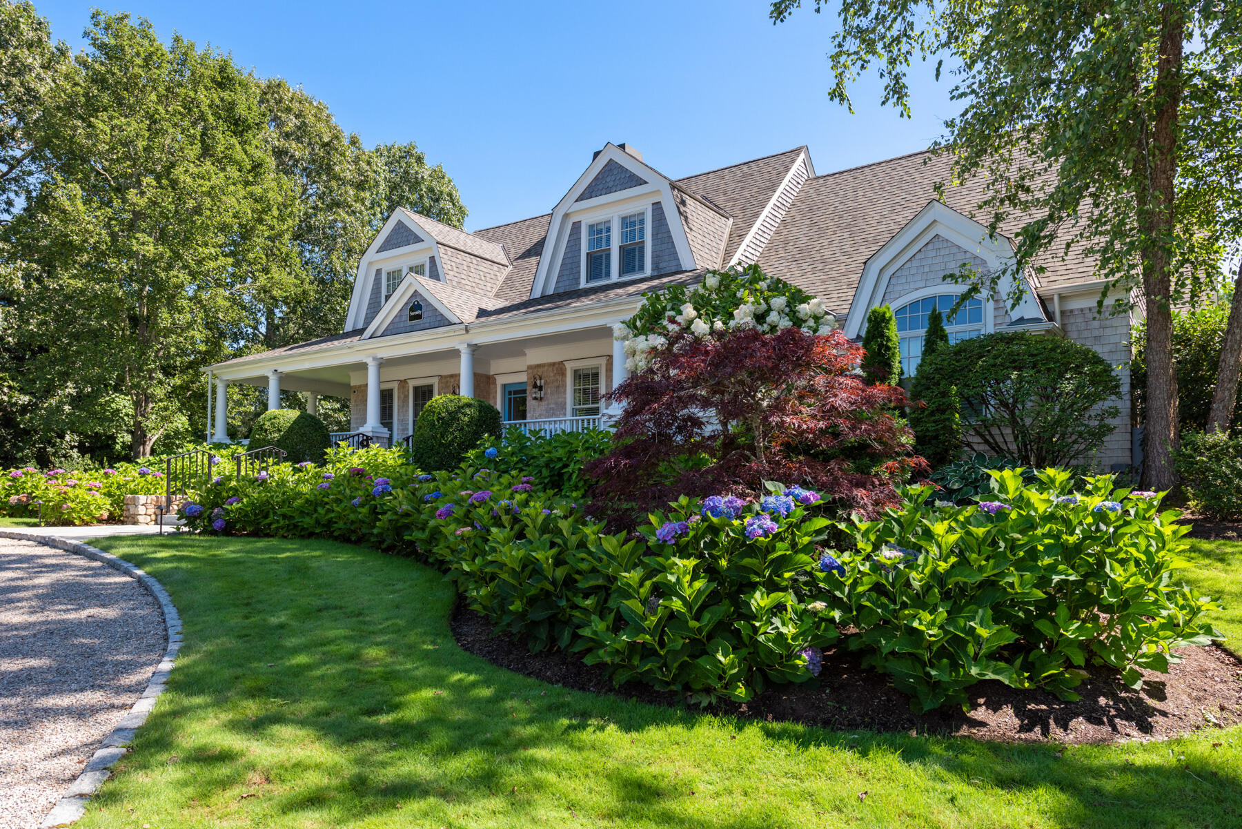 350 Windswept Way Osterville, MA 02655 - Photo 29 of 32 a front view of a house with a garden