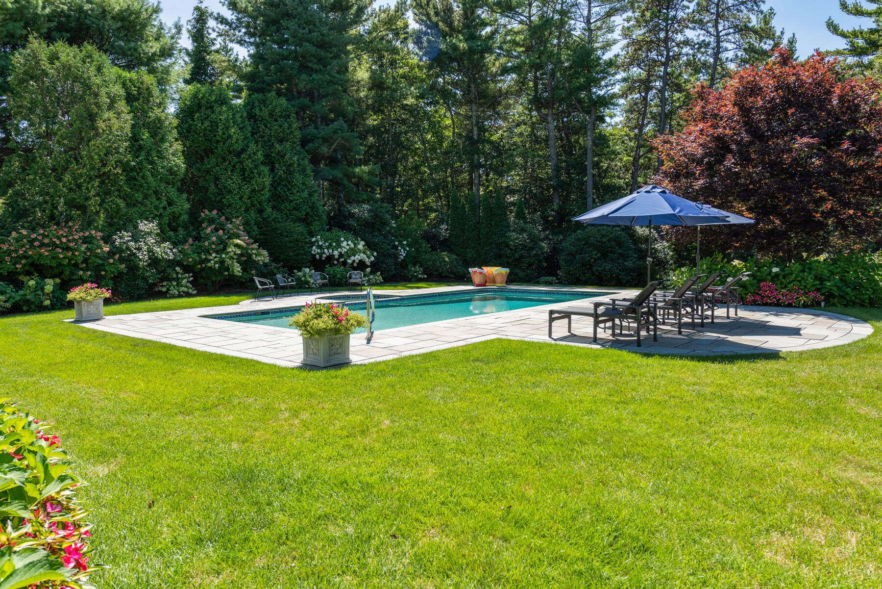 350 Windswept Way Osterville, MA 02655 - Photo 3 of 32 a swimming pool with outdoor seating and yard