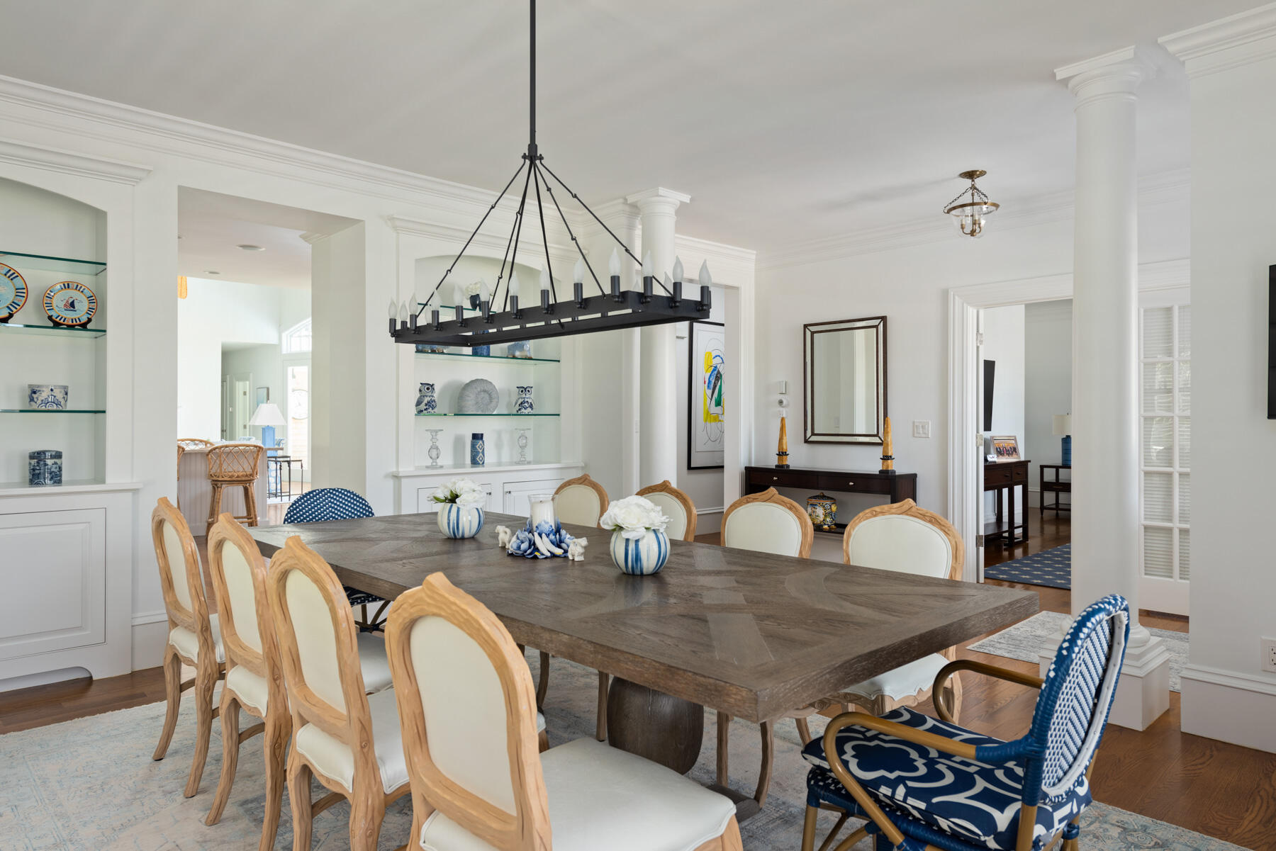 350 Windswept Way Osterville, MA 02655 - Photo 9 of 32 a view of a dining room and livingroom with furniture wooden floor a chandelier