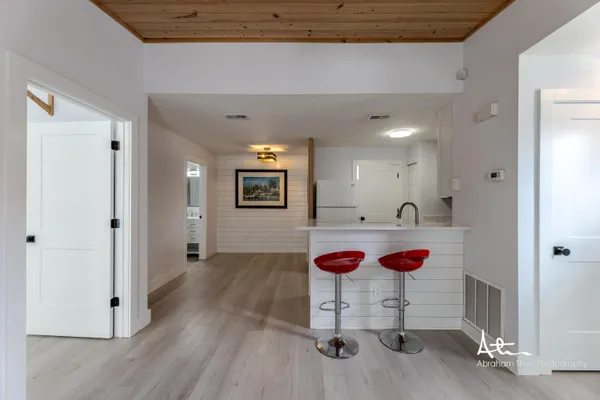 a view of an entryway with wooden floor