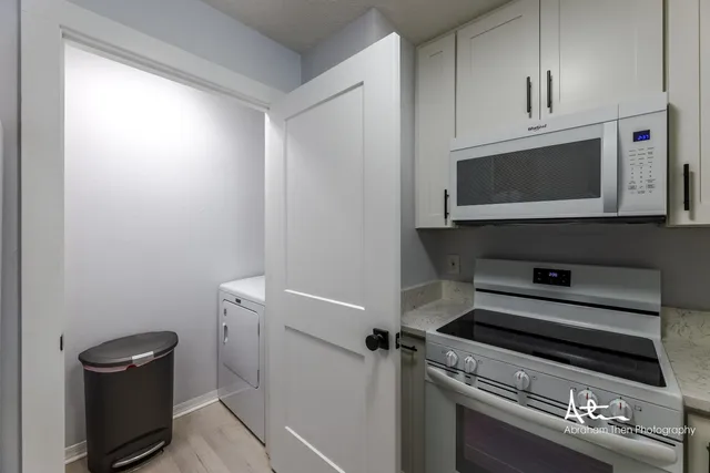 a kitchen with a stove and a microwave