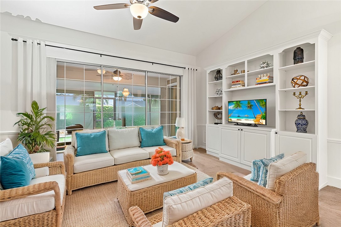 750 Timber Ridge Trail Southwest Vero Beach, FL 32962 - Photo 1 of 26 a living room with furniture and a large window